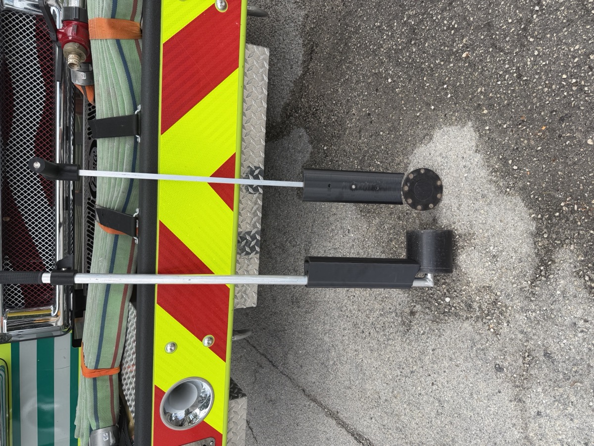 Reelix hose roller — two-arm apparatus-mounted design